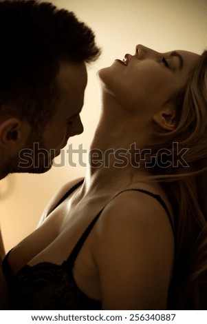 Young attractive sexy couple during foreplay