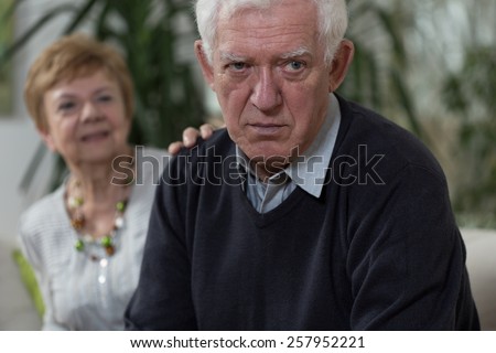 Image of elder wife apologizing husband after argument