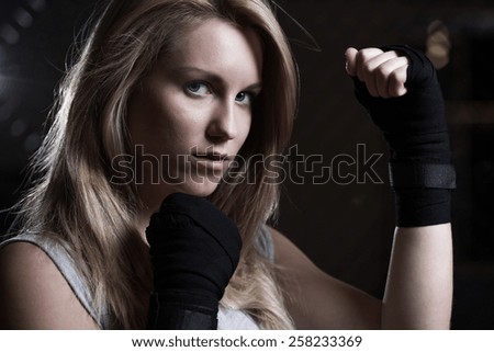 Portrait of beauty fighting girl training pugilism