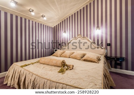 Romantic bedroom with bed in baroque style