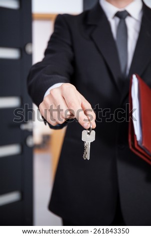 Close-up of the keys in the hands of a real estate agent