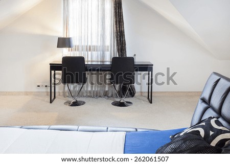 Elegant cozy bedroom with study place