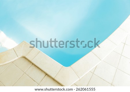 Close-up of swimming pool with marble tiles