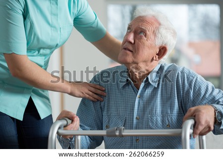 Portrait of disabled senior in care home