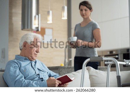 Image of granddaughter helping her disabled grandpa