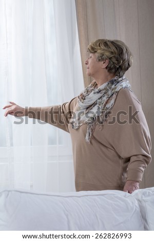 Vertical view of elder woman at home