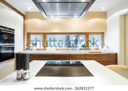 Electric hob on a white wheat in modern kitchen