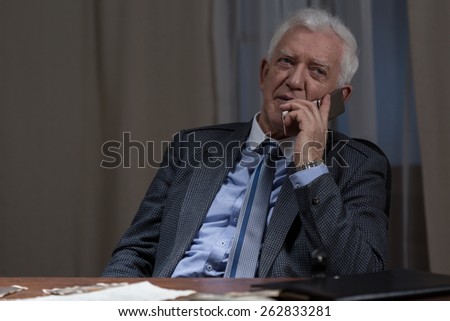 Image of senior businessman being on the phone