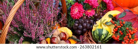 Autumn flowers, vegetables and fruits in basket