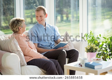 Male carer spending time with elder woman