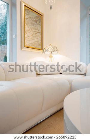 Comfy white couch inside crystal interior, vertical