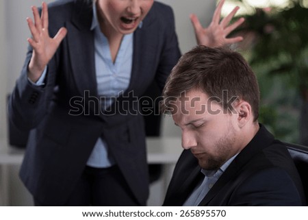 Female boss yelling at employee at work