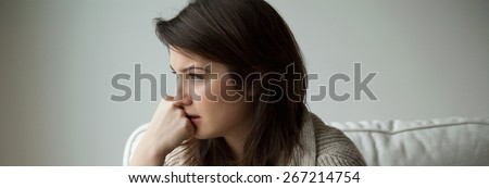 Sad depressed young woman thinking about her life
