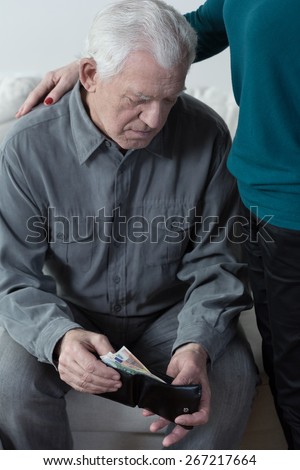 Picture of retired man having financial troubles