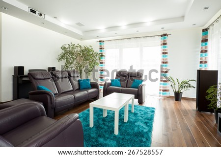 Picture of new luxury family room with brown leather couch