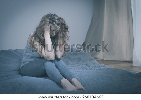 Pretty lonely depressed woman with serious mental problem