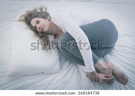 Young pretty lonely woman suffering from mental disease