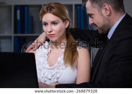 Young woman having sexual relationship at work with older employer
