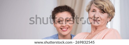 Smiling senior care assistant and patient - panorama