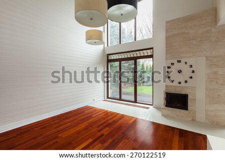 White empty family room with big window in wall