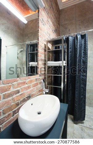 Vertical view of toilet in contemporary designed bathroom