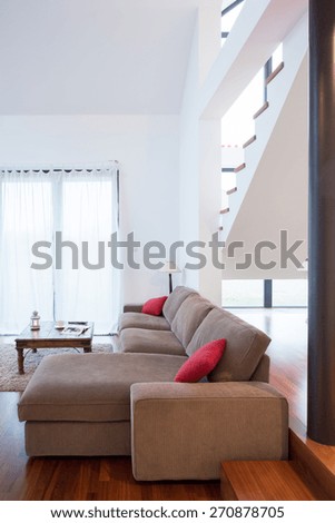 Vertical view of comfortable sofa in family room
