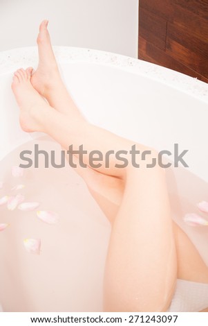 Long legs of sexy woman in bath