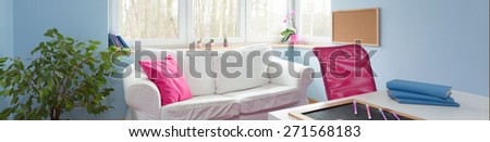 Horizontal view of teenage girl room with pink elements