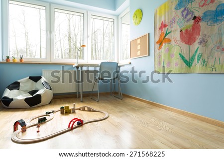 Ball shape sofa and train set in child room