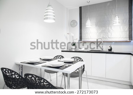 White and bright elegant dining hall with tableware