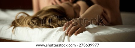 Horizontal view of affectionate couple cultivating sex