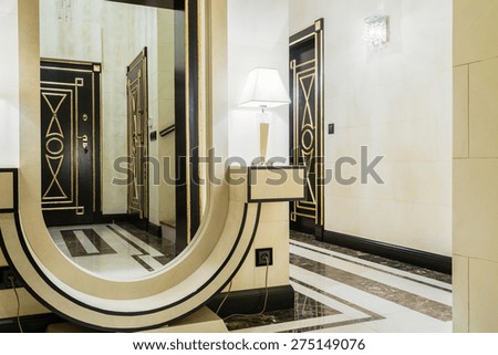 Big extravagant mirror in new modern entrance hall