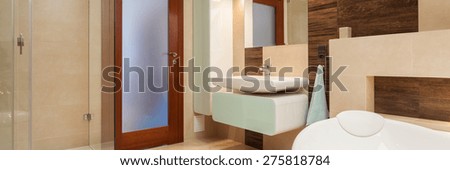 Elegant bathroom interior with bath and shower
