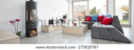 Designed living room with colorful pillows, panorama