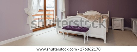 Panorama of bedroom with purple color on wall