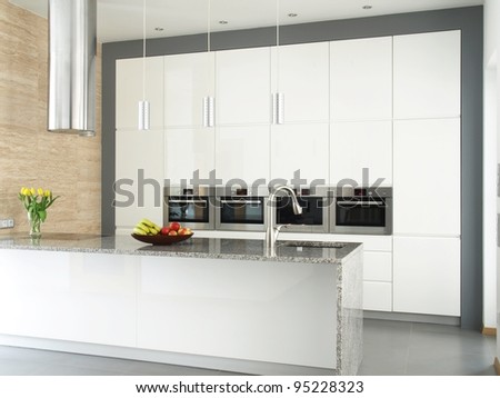 Contemporary kitchen with food and flowers.