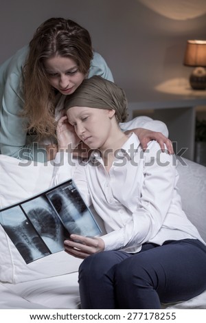 Young despairing cancer woman meeting with friend