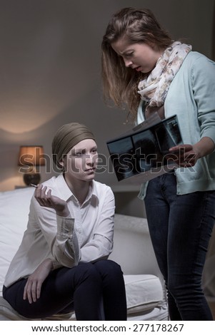Image of depressed cancer woman smoking cigarette