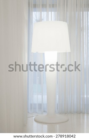 Image of white big lamp in white apartment