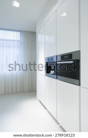 White kitchen units with new built-in oven