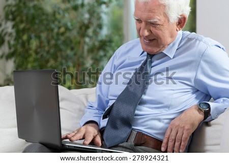 View of senior man with a laptop