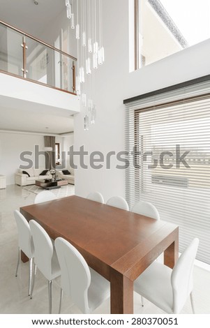 Hardwood family table in modern dining hall