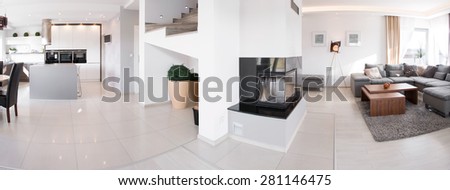 Panorama of kitchen and living room in exclusive residence
