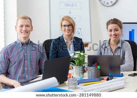 Portrait of young office workers in modern space