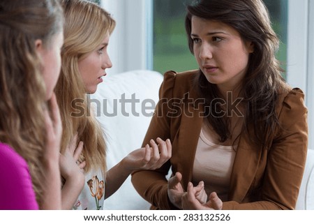 Three supporting girl friends trying to solve a problem