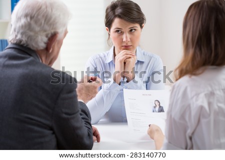Woman during difficult job interview at a corporation
