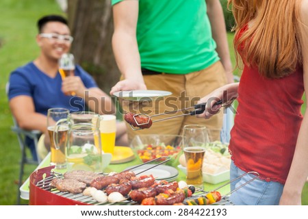 Smiling students during summer party in garden