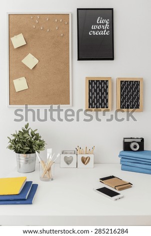 Well organized materials on white desk in office