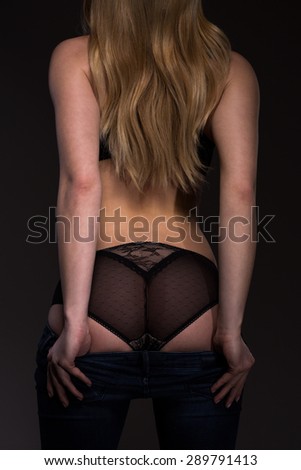 Photo of sexy young woman\'s buttocks in lace pants