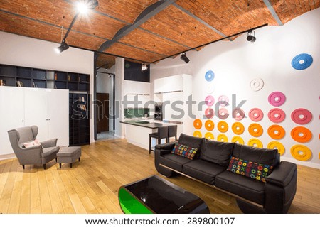 Spacious bright modern lounge with colorful wall Spacious bright modern lounge with colorful wall